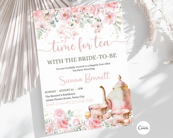 May include: A pink and gold tea party invitation with a floral design and a teapot, teacups, and macarons. The text reads "Time for Tea with the Bride-to-Be".