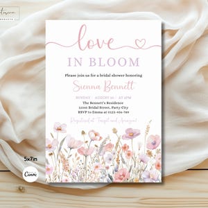 May include: A pink and white bridal shower invitation with a floral design. The invitation reads "love in bloom" and includes the name "Sienna Bennett".