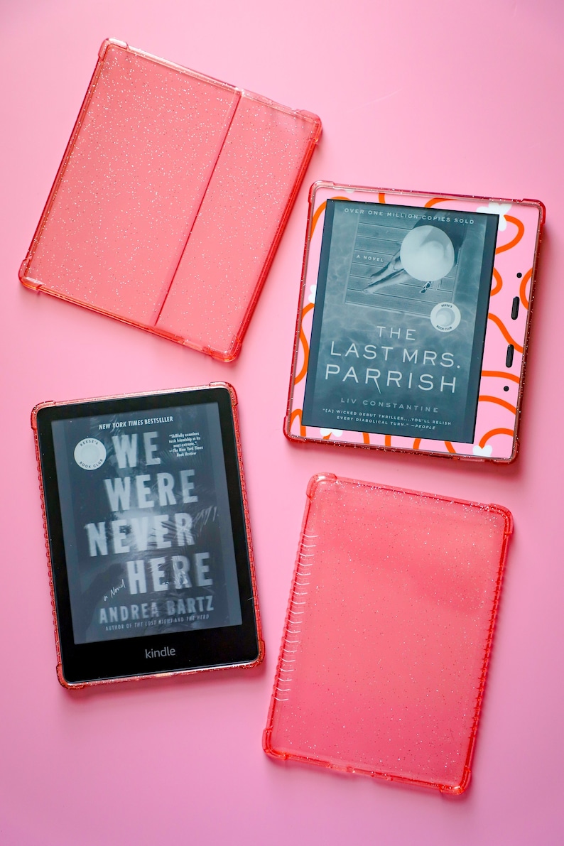 May include: Four pink glitter Kindle e-reader cases with two Kindle e-readers. One Kindle is displaying the cover of "The Last Mrs. Parrish" by Liv Constantine and the other Kindle is displaying the cover of "We Were Never Here" by Andrea Bartz.