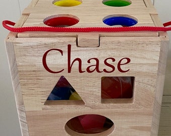Personalized Large Wooden Shape Sorter with hammer tool and easy carry braided handle. Colorful 13 shapes. All wood box and wooden shapes.