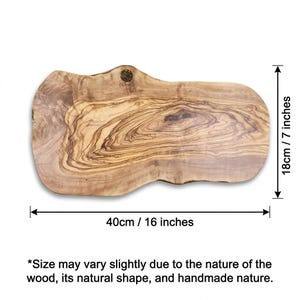May include: An irregular, live-edge wooden serving board with a prominent natural grain pattern. The board features the brand name OLIVIKO stamped near the top edge. It measures 16 inches in length and 7 inches in width as indicated by arrows.