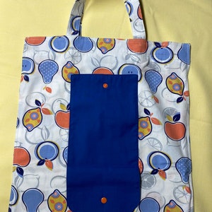 Eco-Friendly reusable/washable grocery tote bag with button clasp for roll up and easy storage