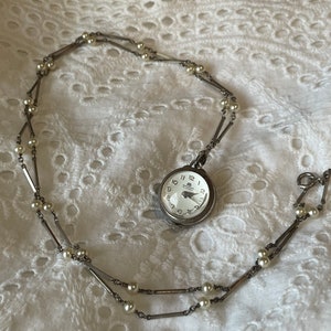 Vintage Bucherer Skeleton back pendant watch with original pearl chain