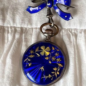 Victorian blue guilloche and gold floral, bird pocket watch with blue enamel and gold star ribbon watch brooch.