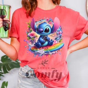 a woman in a pink shirt holding a drink