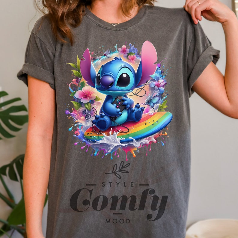 a woman wearing a gray t - shirt with an image of a stitching stitch