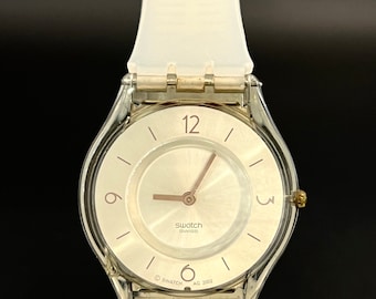 Montre-bracelet transparente Swatch vintage 2002, design classique, fonctionnant avec une pile neuve