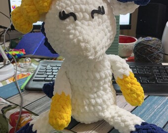 Crocheted large unicorn yellow and blue
