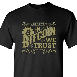 May include: Black t-shirt with a gold graphic that says "Crypto In Bitcoin We Trust" with a stylized Bitcoin symbol.