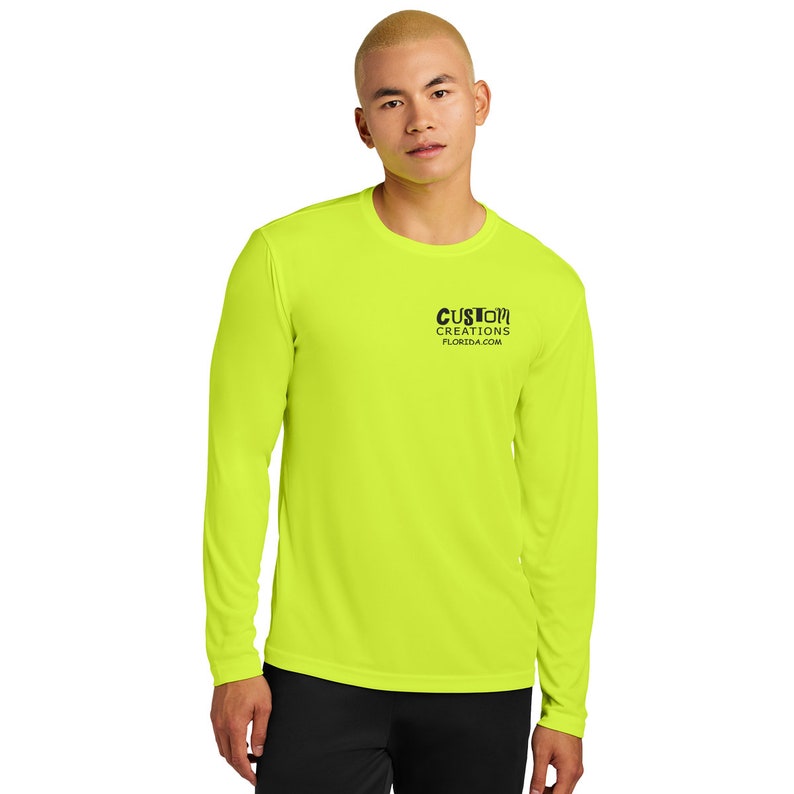 May include: A bright yellow long-sleeve shirt with a black logo that reads "CUSTOM CREATIONS FLORIDA.COM"