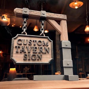 May include: A custom tavern sign with the words "CUSTOM TAVERN SIGN" in raised, dark gray letters. The sign is suspended by chains from a wooden beam and supported by a wooden post. The sign has a light brown background and a dark gray border.