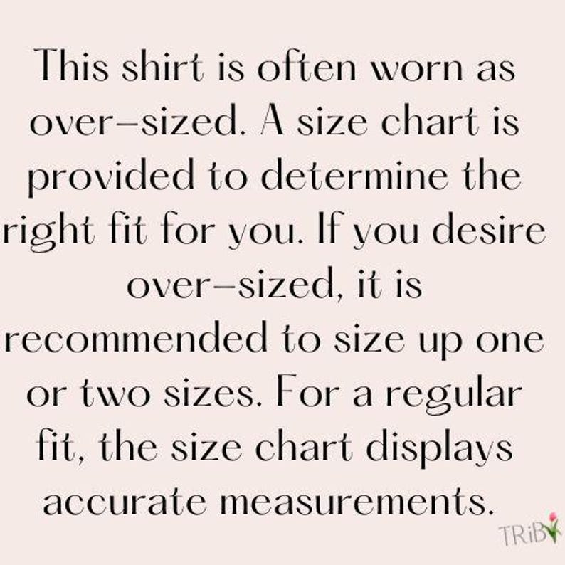 May include: Text on a light pink background reads: "This shirt is often worn as over-sized. A size chart is provided to determine the right fit for you. If you desire over-sized, it is recommended to size up one or two sizes."