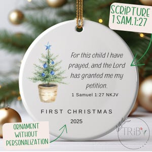 May include: Round white Christmas ornament featuring a watercolour Christmas tree with blue baubles and a star. The text reads "For this child I have prayed..." and "First Christmas 2025".