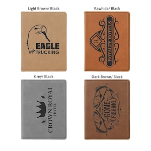 May include: Four leatherette passport holders in various colors: light brown, rawhide, grey, and dark brown. Each features a unique black design and text, including an eagle, the words "Royalty Hotels", a crown, and the words "Gone Fishing".