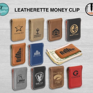 May include: Ten different leatherette money clips with various logos and designs. The money clips are brown, black, grey, blue, and red. The logos include a star, a trident, a golf club, a city skyline, and a letter G.