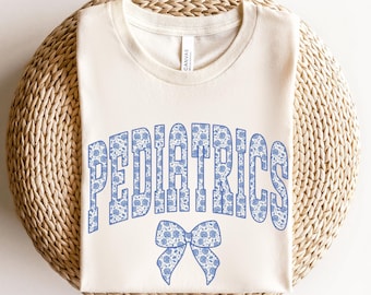 Pediatrics Shirt • Coquette Bow PEDS Work Tees • Pediatric Nurse Gifts • Blue Flower Pediatrics Gift • PEDS ER Icu Pt Ot Graduation Gift