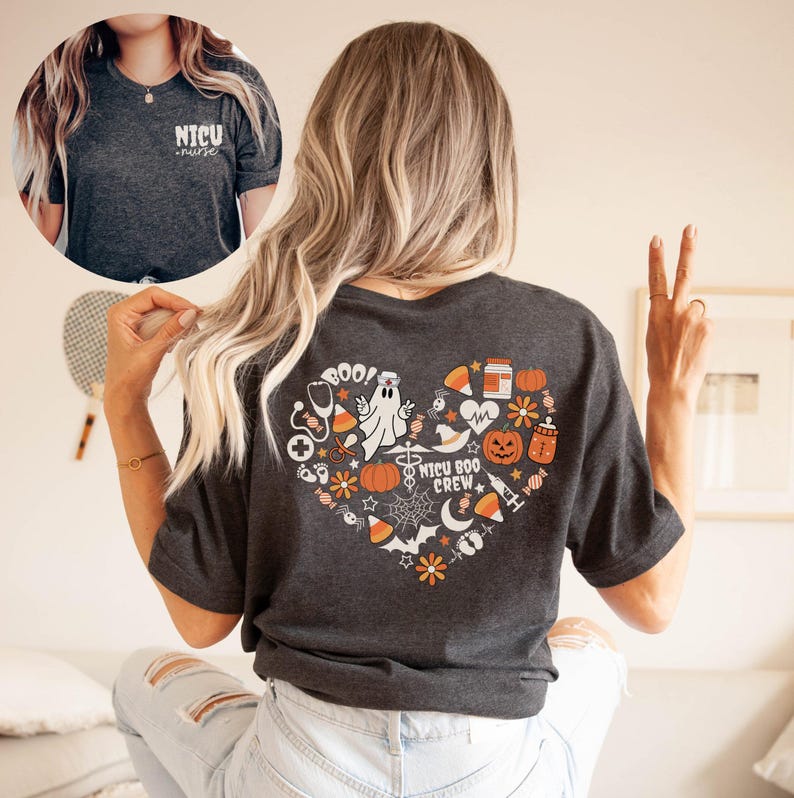 May include: Dark gray t-shirt with a heart-shaped Halloween design on the back, featuring a ghost, pumpkins, and the words "NICU BOO CREW." The front of the shirt has the words "NICU nurse."