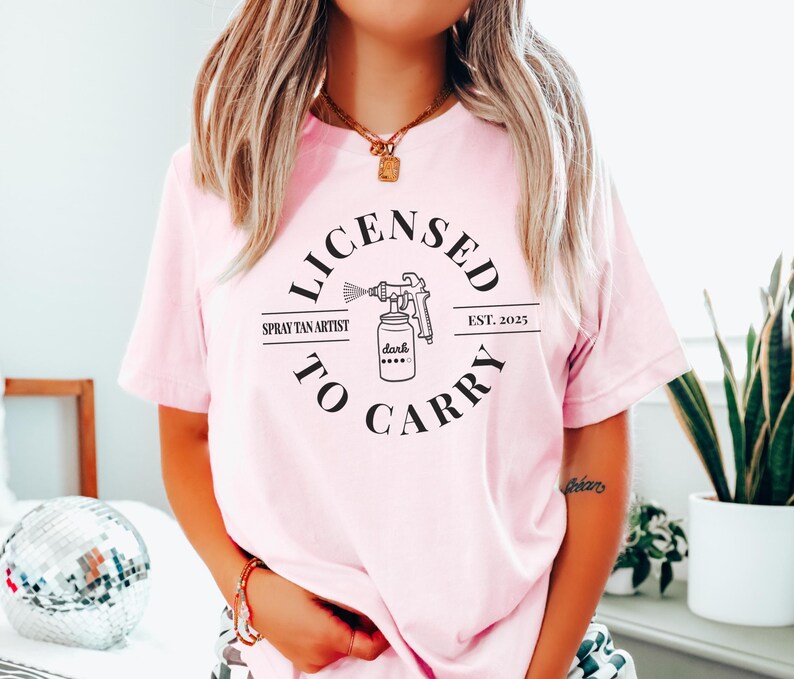 Spray Tan Artist Shirt • Licensed To Carry Spray Tan Artist Work Tshirt • Personalized Spray Tan Tech EST. 2025 Gift • Sunless Tanning Salon Pink
