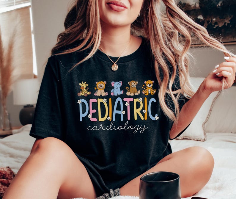 May include: Black t-shirt with a colourful graphic of animals and the text "PEDIATRIC cardiology".