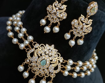 Sabyasachi Inspired Gold Finish Choker Set with Pearls and American Diamond Stones - Turquoise