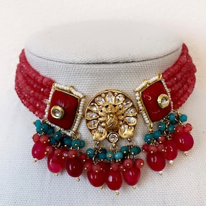 Gold Finish Bright Red and Teal Kundan Choker Set with Peacock Centerpiece, Pearls, Mona Lisa Beads, and Carved Stones