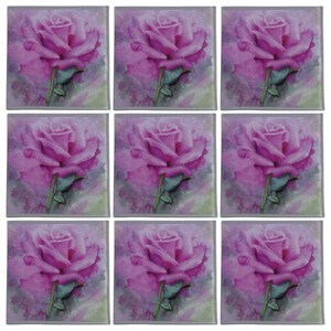May include: Nine square ceramic tiles with a watercolor-style image of a pink rose on each tile. The background is a soft purple and gray.