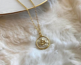 Gouden parelketting engel