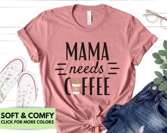 May include: A pink t-shirt with the text "MAMA needs COFFEE" in black lettering. A coffee cup icon is included in the text.