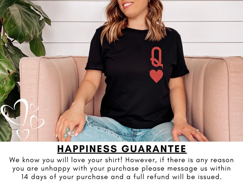 May include: A black t-shirt with a red queen of hearts graphic. The text "HAPPINESS GUARANTEE" is printed below the image. The text reads: "We know you will love your shirt! However, if there is any reason you are unhappy with your purchase please message us within 14 days of your purchase and a full refund will be issued."