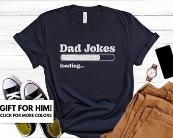 May include: A navy blue t-shirt with the text "Dad Jokes" and a loading bar graphic. The text "loading..." is below the graphic.