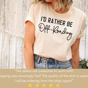 May include: A white t-shirt with black text that reads "I'd rather be Off-Roading".