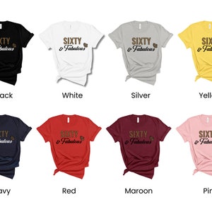 May include: A set of ten t-shirts in various colors, each featuring the text "SIXTY & Fabulous" in gold glitter lettering. The shirts are displayed on a white background.