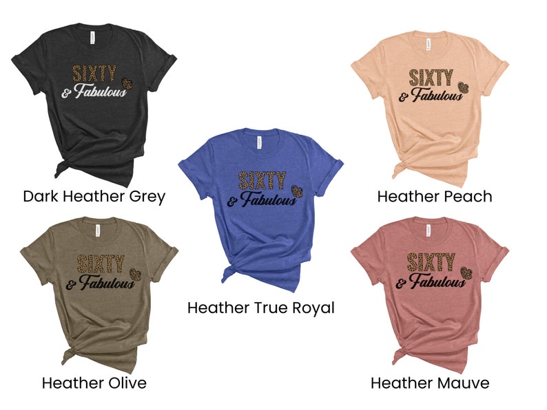 May include: Six different color t-shirts with the text "SIXTY & Fabulous" in a leopard print font. The colors are dark heather grey, heather peach, heather true royal, heather olive, and heather mauve.