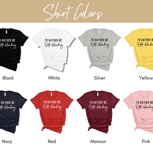 May include: A mockup of a t-shirt design with the text "I'd rather be off-roading". The shirt is shown in ten different colors: black, white, silver, yellow, navy, red, maroon, pink, heather grey, and light blue.