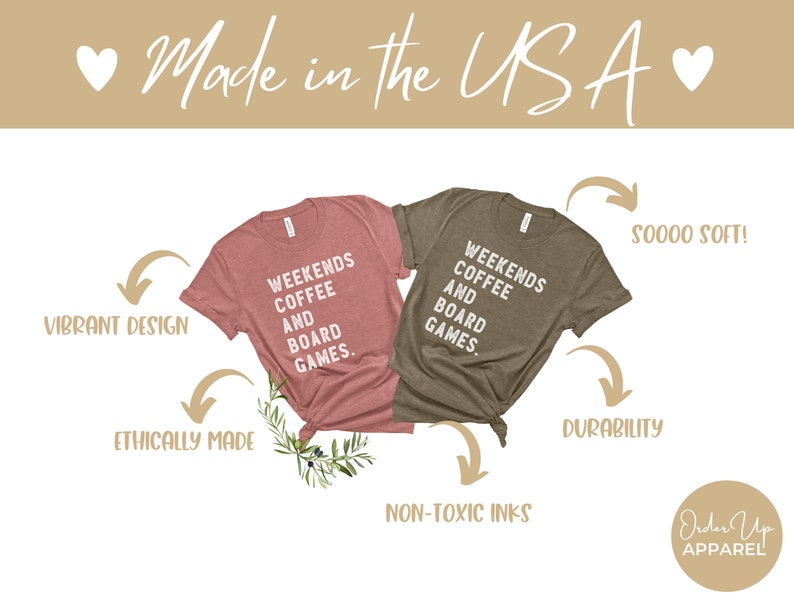 May include: Two heather grey t-shirts with white text that reads "Weekends Coffee and Board Games." The shirts are displayed on a white background with arrows pointing to the words "Vibrant Design," "Ethically Made," "Soooo Soft!," "Durability," "Non-Toxic Inks," and "Order Up Apparel."