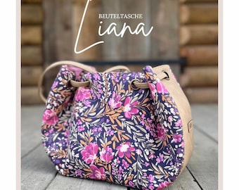 Op de afbeelding: Een bloemenprint trekkoordtas met een bruine leren afwerking. De tas heeft een lange band en is gelabeld "BEUTELTASCHE Liana".