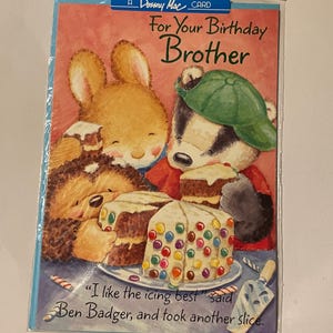 May include: A birthday card with a colourful illustration of a rabbit and a badger sharing cake. The card reads "For Your Birthday Brother" and includes a quote from Ben Badger about the icing.