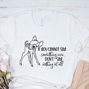 May include: White t-shirt with a black outline of a deer and the text "If you cannot say something nice, don't say nothing at all".