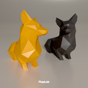 Op de afbeelding: Twee origami-papierhondensculpturen, een gele en een zwarte, die op een grijs oppervlak zitten. De sculpturen zijn gemaakt van gevouwen papier en hebben een geometrisch ontwerp.