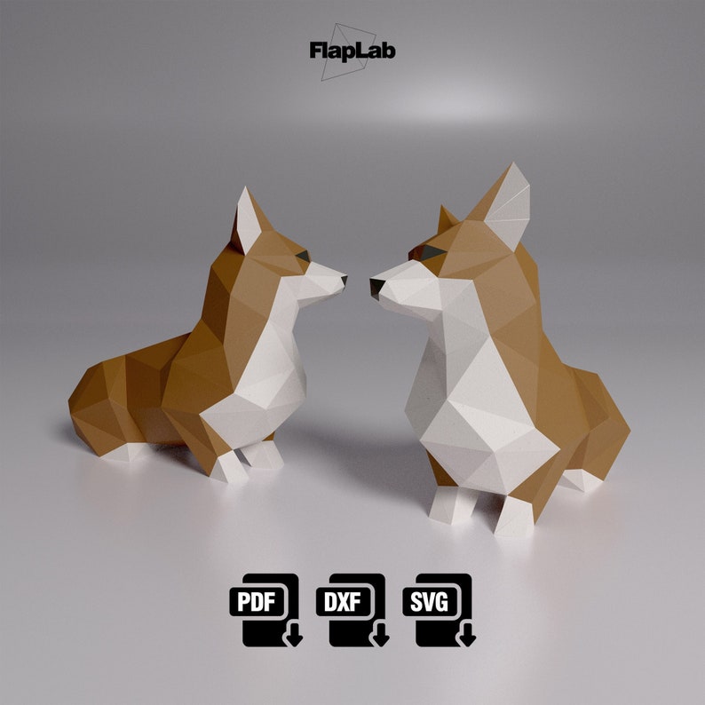 Op de afbeelding: Twee origami-papiermodellen van bruine en witte corgis die elkaar aankijken. De corgis zijn gemaakt van gevouwen papier en hebben een 3D-effect. De modellen staan op een grijze achtergrond. De afbeelding bevat de tekst "FlapLab" bovenaan.