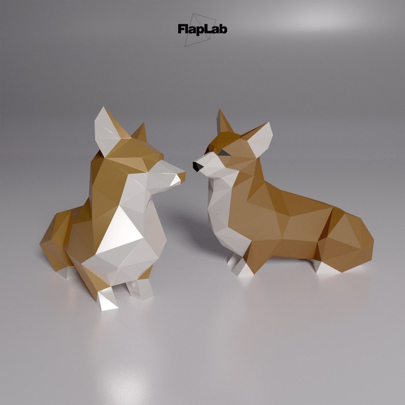Op de afbeelding: Twee origami-papiercorgi's, een bruin en wit, de andere bruin, die elkaar aankijken. De honden zijn gemaakt van gevouwen papier en hebben een 3D-uitstraling.