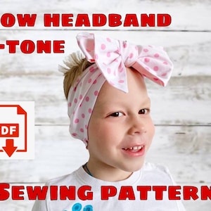 May include: A sewing pattern for a two-tone bow headband. The pattern is available as a PDF download. The image shows a child wearing a pink and white polka dot headband with a large bow.