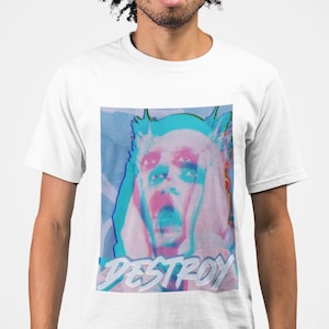 May include: White t-shirt featuring a graphic design with a distressed, glitch-effect image of a person's face in pink and blue hues. The word "DESTROY" is printed in a stylized font below the image.
