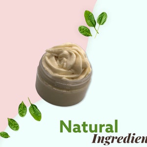 May include: A close-up of a white jar filled with a creamy, whipped body butter. The jar is on a pink and blue background with green leaves scattered around it. The text "Natural Ingredient" is written in green letters below the jar.