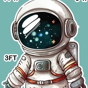 May include: A cartoon astronaut wearing a white spacesuit with orange accents and a black helmet with a starry sky inside. The astronaut is 3 feet tall. There is a 9 inch high image of a galaxy and a 11 inch high image of a spaceship.
