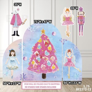 May include: A set of Christmas-themed decorations featuring a pink Christmas tree, ballerinas, a nutcracker, and a mouse. The tree measures 71" x 47", and the ballerinas and nutcracker are 35" high. The text says, "ITEM WILL BE FOLDED DUE TO SHIPPING NO STANDS NOR STAKES INCLUDED."
