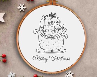 May include: Black and white line drawing of two cats riding in a sleigh with presents. The sleigh is decorated with polka dots. The text "Merry Christmas" is written below the sleigh.
