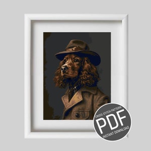 Peut inclure: Un modèle de point de croix en téléchargement PDF représentant un chien brun et blanc portant un fedora brun et un manteau brun. Le chien regarde vers la gauche. Le texte "CROSS STITCH PATTERN PDF INSTANT DOWNLOAD" est sur un cercle gris.