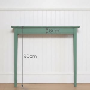 May include: A sage green console table with a rectangular top and four straight legs. The table features a visible measurement of 8 cm for the apron height and 90 cm for the total height from the floor to the top surface of the console table.