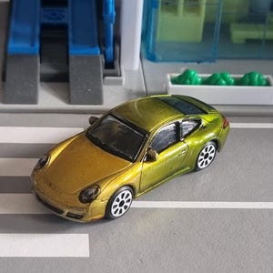 Porsche 911 1:64 scale die cast car, unbranded, transformed with custom paint and tyres